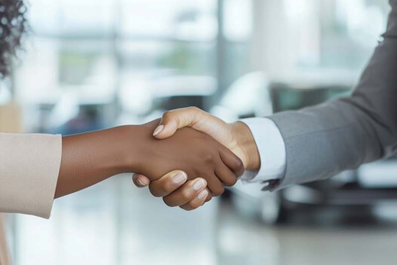 Chartered SRI Investor shaking hands